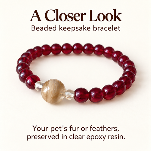 Burgundy bracelet detail card showing the fur-filled focal bead, two clear spacers, and a note about pet fur or feathers in clear epoxy resin.